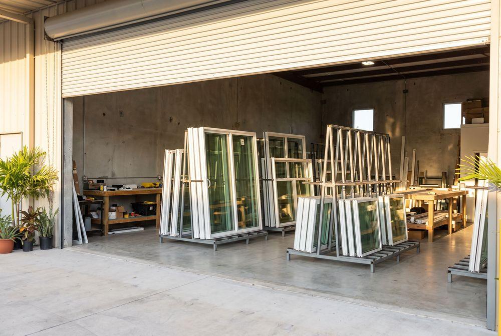 Workshop with glass panels and door units prepared for service