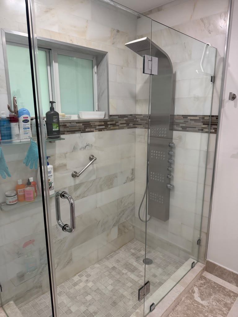 Frameless glass shower door, freshly installed
