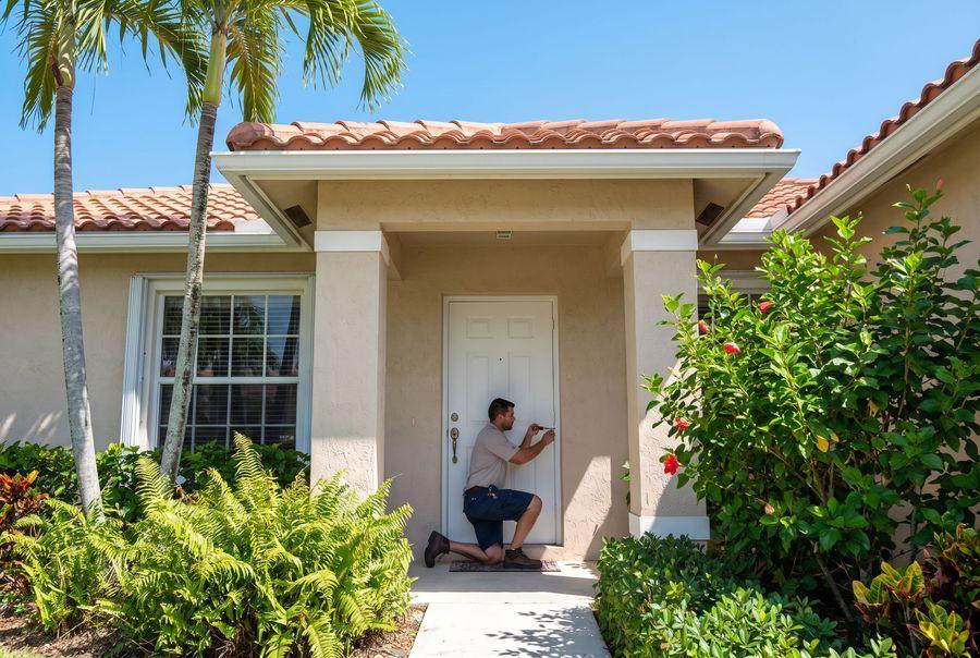 Front entry door being repaired at a South Florida home