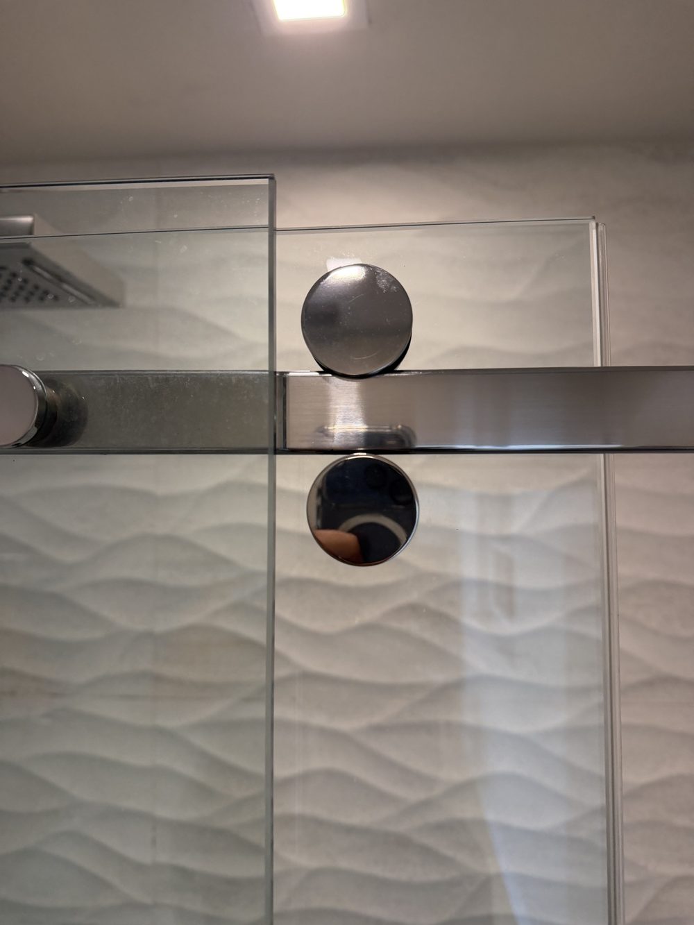 New rollers on a frameless sliding shower door